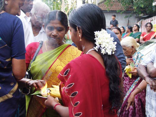 Festival-goers share the blessings.