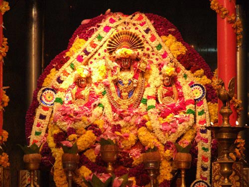 God Sri Sivasubramaniya Swamy, and Goddesses Valli Ammai and Thivaiyanai are decorated with fresh flowers and silk for the festival