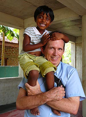 Patrick Harrigan with a Visions of Hope child