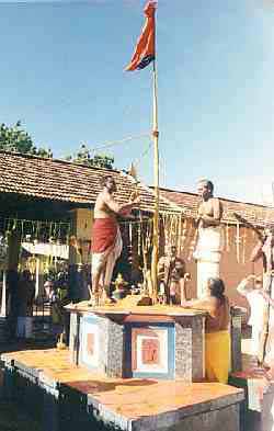 Flag-hoisting at Teyvanai Amman Kovil [12 kb]